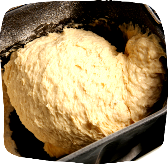Image of Place the bread machine's metal basket in the clockwise position.